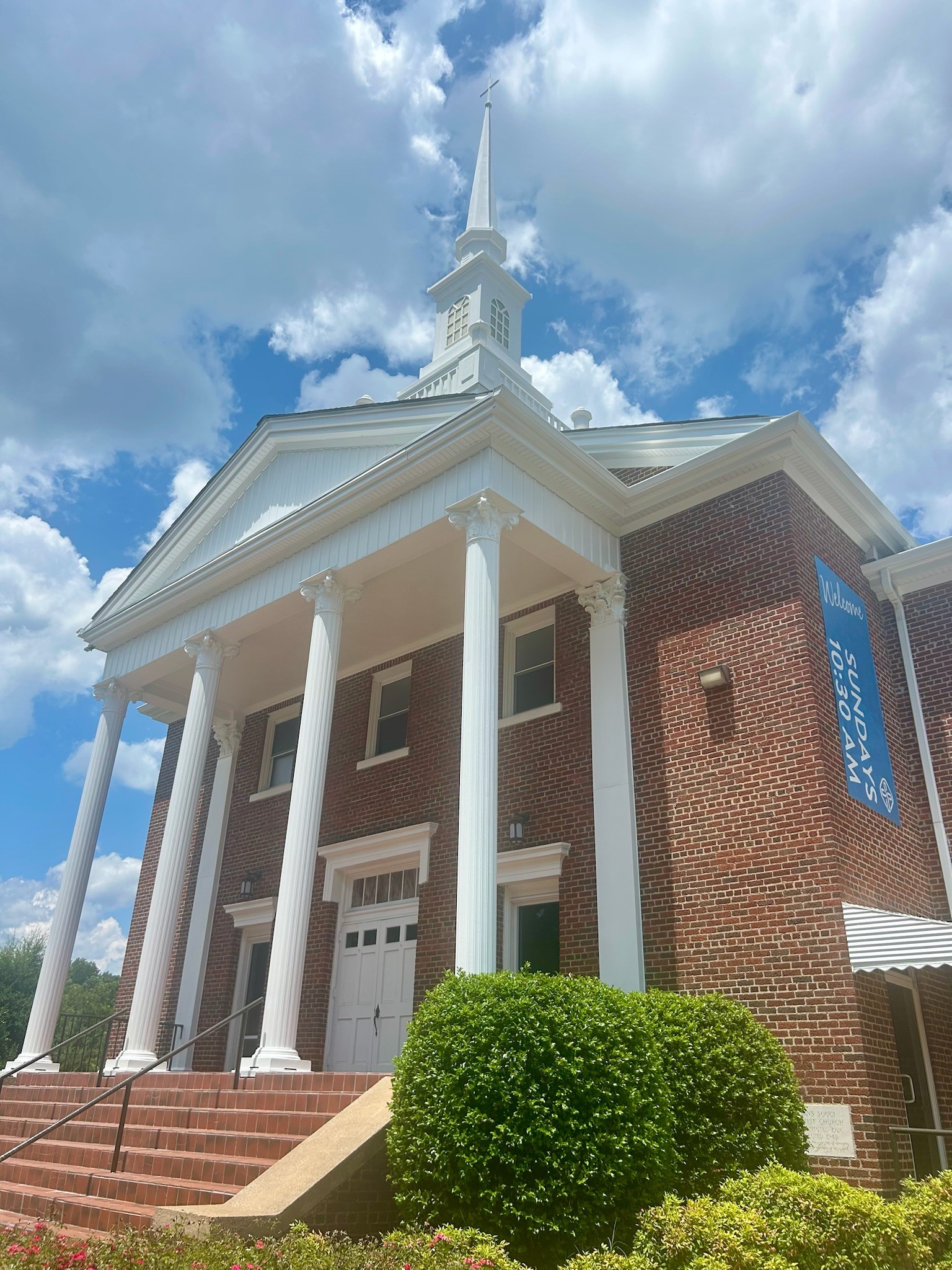 Church exterior repaint with white columns, trim, and steeple
