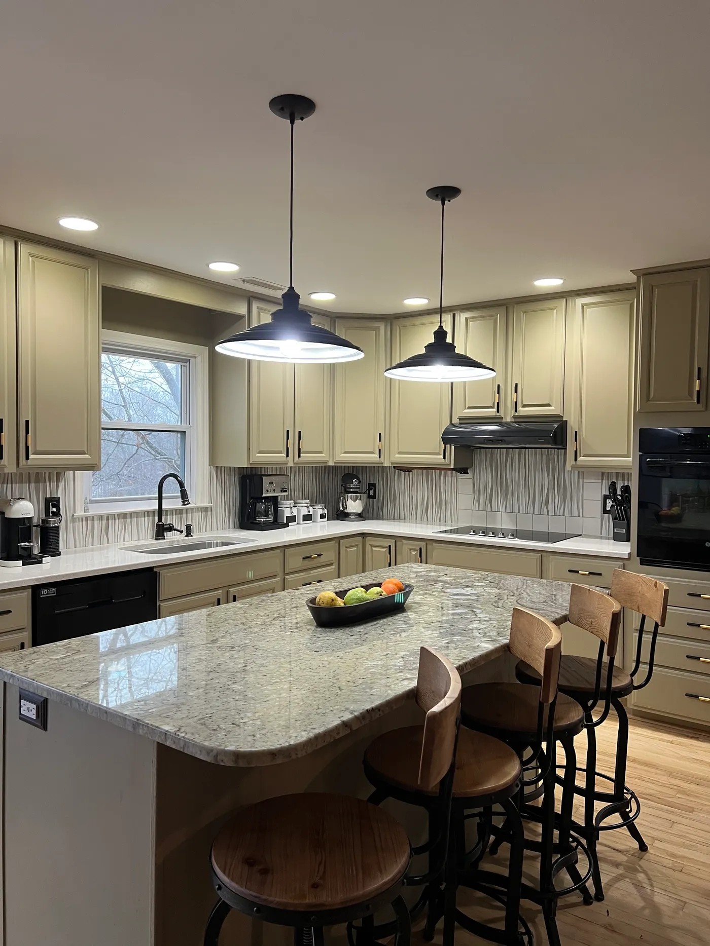 Full kitchen repaint with painted cabinets and island by Greene Painting