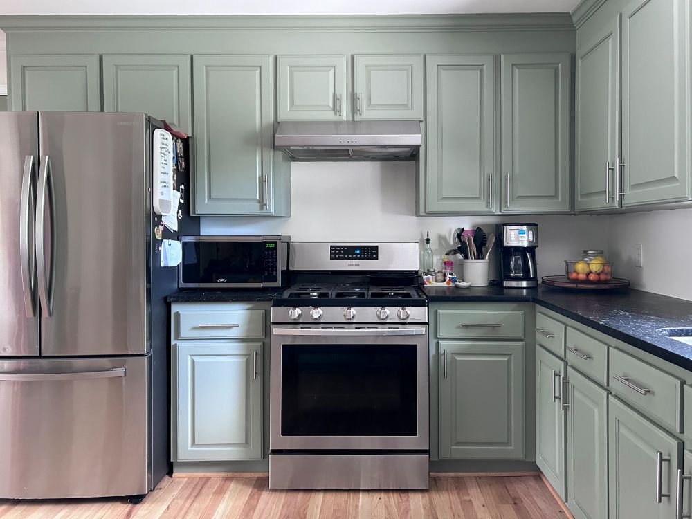 Sage green kitchen cabinet repaint by Greene Painting